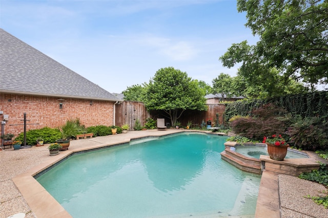 308 Dunlin Ln, Coppell, TX 75019 - view of swimming pool featuring a fenced backyard, a diving board, and a pool with connected hot tub