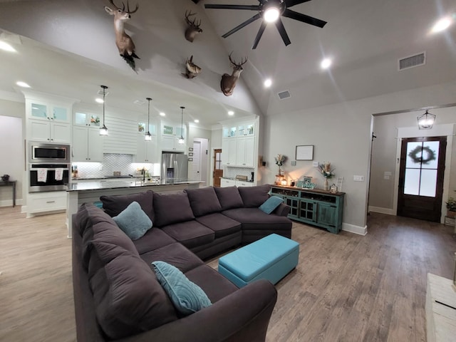 12890 County Road 463, Tyler, TX 75706 - living area featuring a ceiling fan, light wood finished floors, baseboards, high vaulted ceiling, and recessed lighting