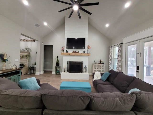 12890 County Road 463, Tyler, TX 75706 - living area featuring ceiling fan, high vaulted ceiling, recessed lighting, a fireplace, and wood finished floors