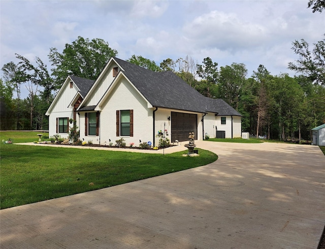 12890 County Road 463, Tyler, TX 75706 - modern farmhouse style home with concrete driveway, a garage, a front lawn, board and batten siding, and brick siding