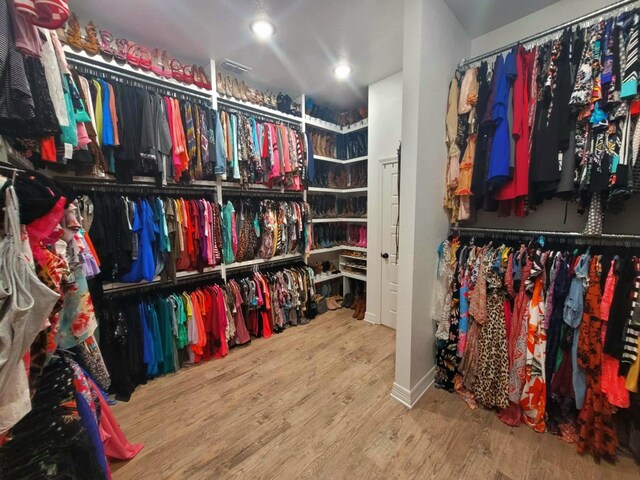 12890 County Road 463, Tyler, TX 75706 - walk in closet with wood finished floors