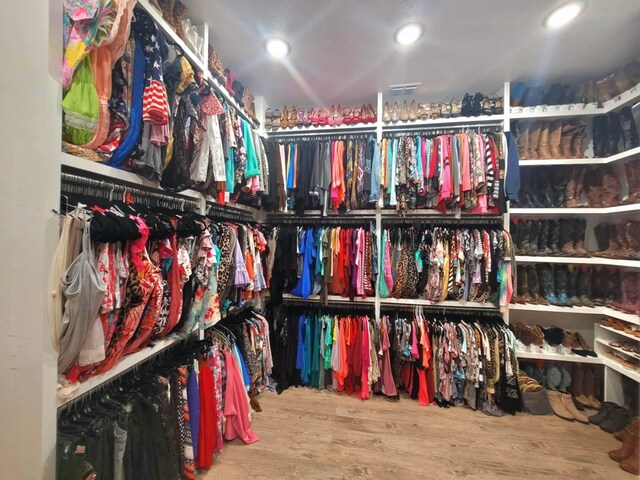 12890 County Road 463, Tyler, TX 75706 - walk in closet with wood finished floors