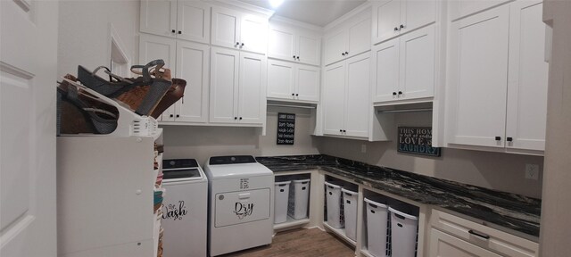 12890 County Road 463, Tyler, TX 75706 - washroom featuring cabinet space, washing machine and dryer, and wood finished floors