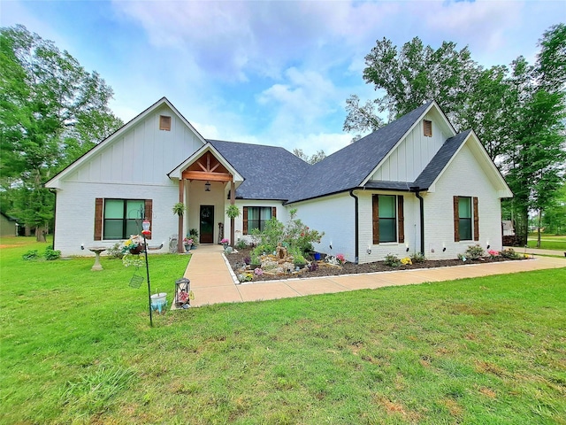 12890 County Road 463, Tyler, TX 75706 - modern inspired farmhouse with board and batten siding, brick siding, a front yard, and a shingled roof