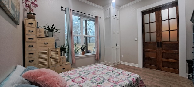 12890 County Road 463, Tyler, TX 75706 - bedroom featuring ornamental molding, wood finished floors, and baseboards