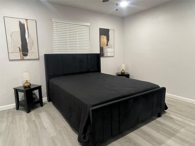 2721 San Marcus Ave, Dallas, TX 75228 - bedroom with light wood-style flooring, baseboards, and a ceiling fan
