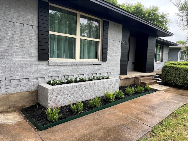 2721 San Marcus Ave, Dallas, TX 75228 - doorway to property featuring brick siding