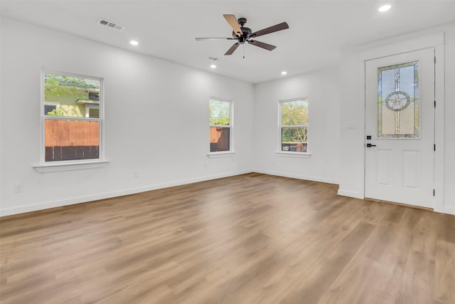 entryway with a ceiling fan, recessed lighting, visible vents, and wood finished floors