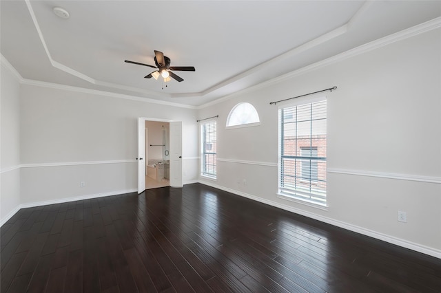unfurnished room featuring dark wood finished floors, baseboards, a raised ceiling, and ceiling fan