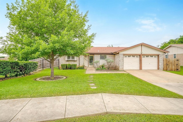 single story home featuring a garage, fence, a front yard, brick siding, and driveway