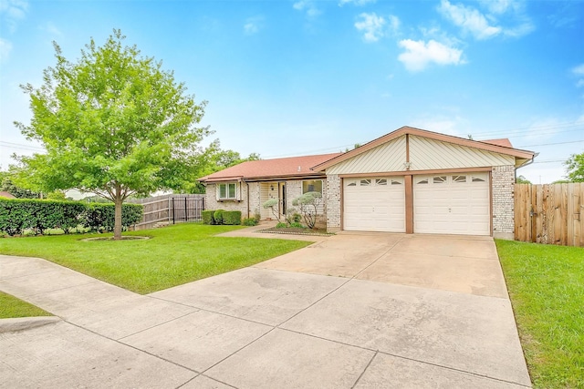ranch-style home with a front lawn, brick siding, fence, and a garage