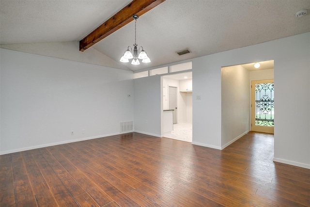 unfurnished room featuring a chandelier, dark wood-type flooring, and visible vents