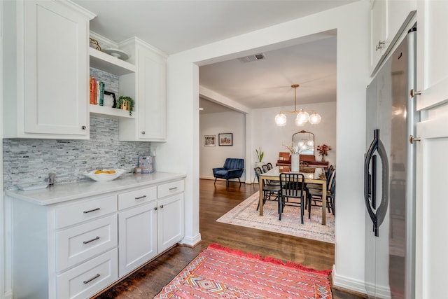 kitchen featuring open shelves, visible vents, white cabinetry, backsplash, and dark wood-style floors