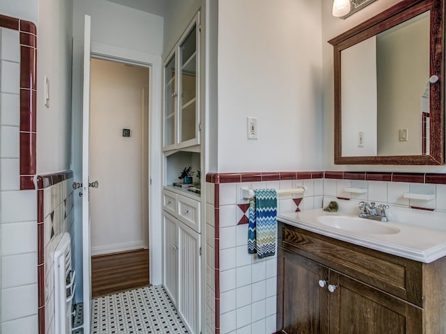 bathroom featuring vanity, tile walls, and tile patterned floors
