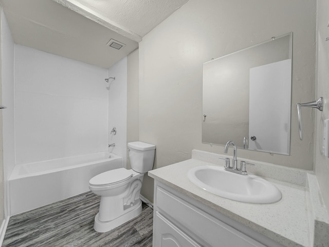4250 Leland College Dr, Dallas, TX 75241 - full bath featuring toilet, wood finished floors, bathing tub / shower combination, visible vents, and vanity
