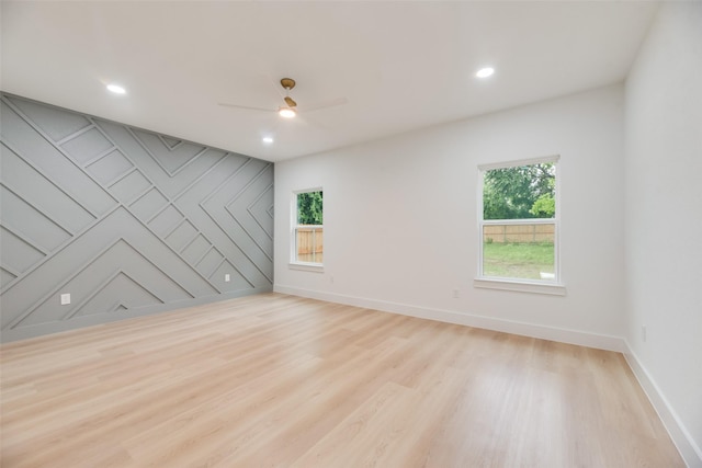 3904 De Maggio Ave, Dallas, TX 75210 - empty room featuring ceiling fan, light wood-type flooring, a healthy amount of sunlight, and recessed lighting