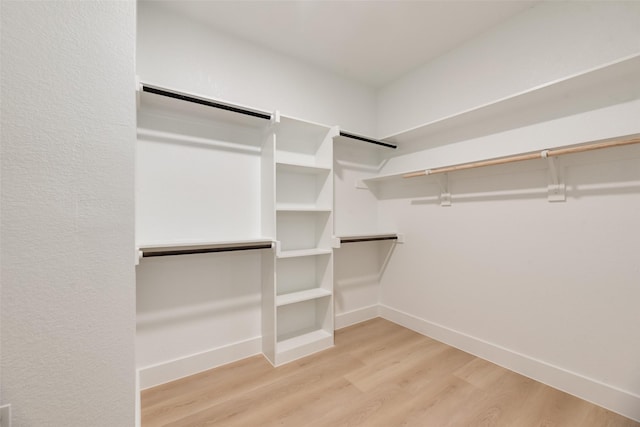 3904 De Maggio Ave, Dallas, TX 75210 - walk in closet with wood finished floors
