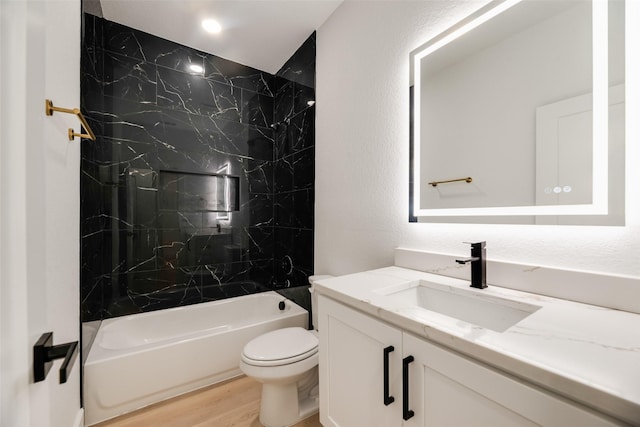 3904 De Maggio Ave, Dallas, TX 75210 - bathroom featuring toilet, wood finished floors, vanity, and shower / bathtub combination