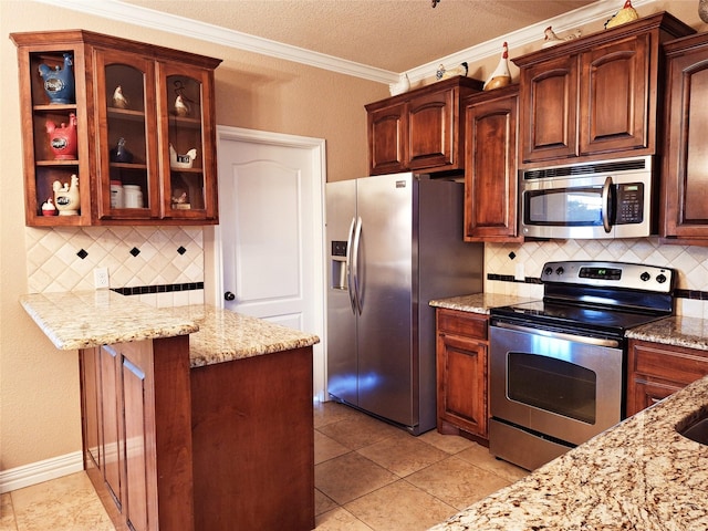 334 Miss Ellie Ln, Abilene, TX 79602 - kitchen featuring crown molding, stainless steel appliances, tasteful backsplash, and light stone countertops