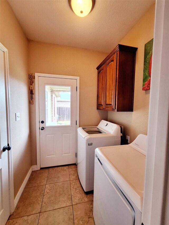334 Miss Ellie Ln, Abilene, TX 79602 - washroom featuring baseboards, separate washer and dryer, light tile patterned flooring, and cabinet space