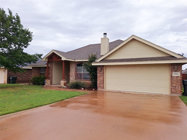 334 Miss Ellie Ln, Abilene, TX 79602 - ranch-style house featuring a front yard, brick siding, and driveway