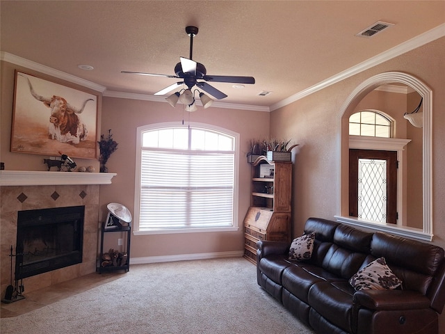 334 Miss Ellie Ln, Abilene, TX 79602 - living room featuring a tile fireplace, a healthy amount of sunlight, ceiling fan, and visible vents
