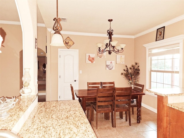 334 Miss Ellie Ln, Abilene, TX 79602 - dining room with light tile patterned floors, a chandelier, baseboards, and ornamental molding