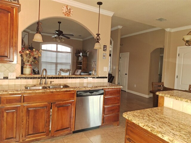 334 Miss Ellie Ln, Abilene, TX 79602 - kitchen with dishwasher, brown cabinetry, arched walkways, and a sink