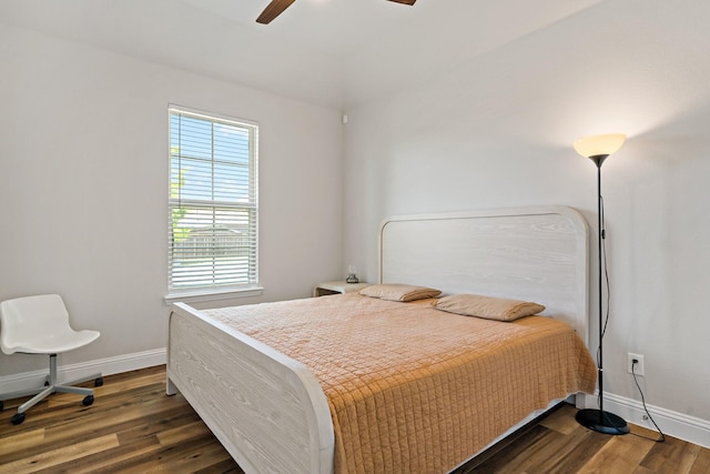 bedroom with baseboards, ceiling fan, and dark wood-style floors