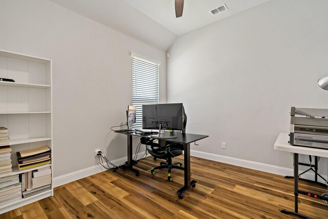 office area with wood finished floors, visible vents, baseboards, and ceiling fan