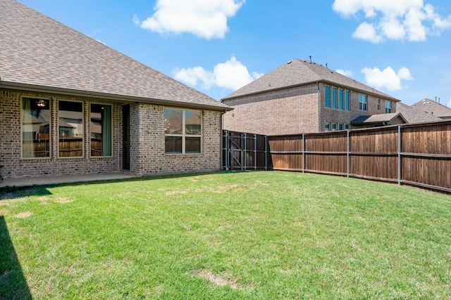 view of yard featuring a fenced backyard