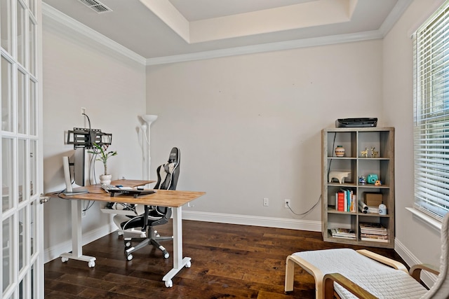 office with dark wood finished floors, visible vents, and a healthy amount of sunlight