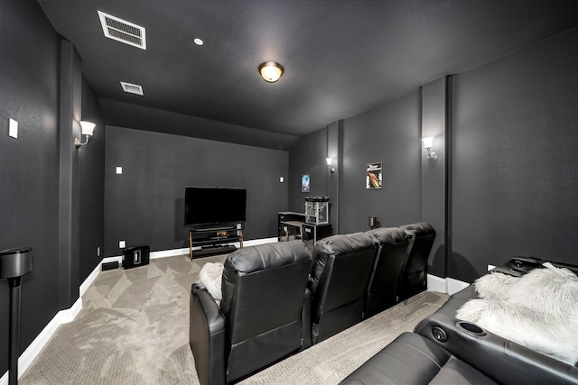 carpeted home theater featuring baseboards