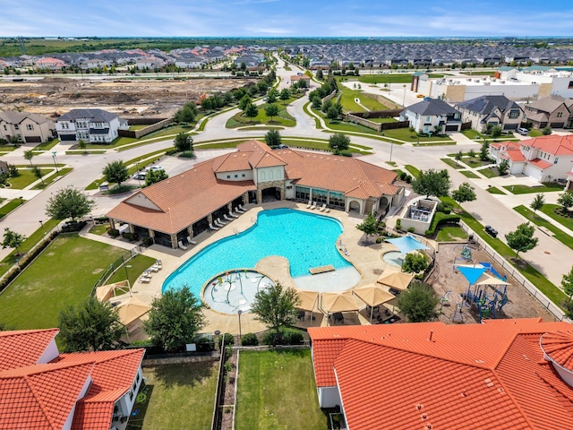 aerial view of residential area featuring a pool