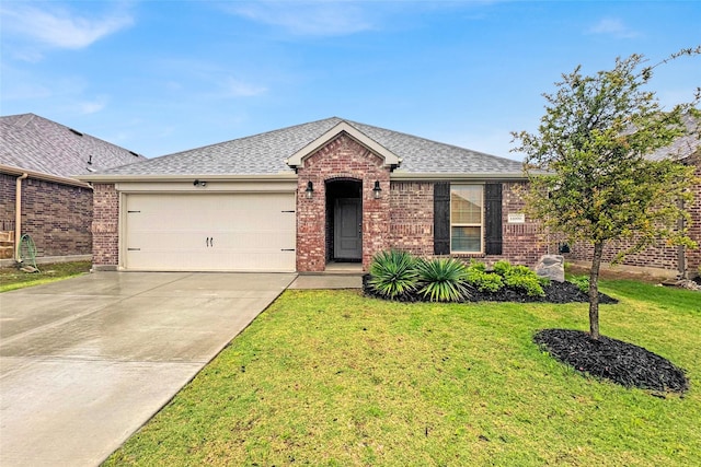 ranch-style house featuring an attached garage, a shingled roof, brick siding, and driveway