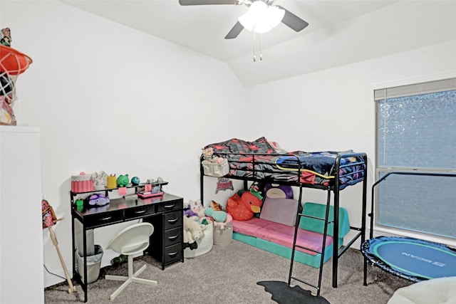 carpeted bedroom featuring vaulted ceiling and ceiling fan
