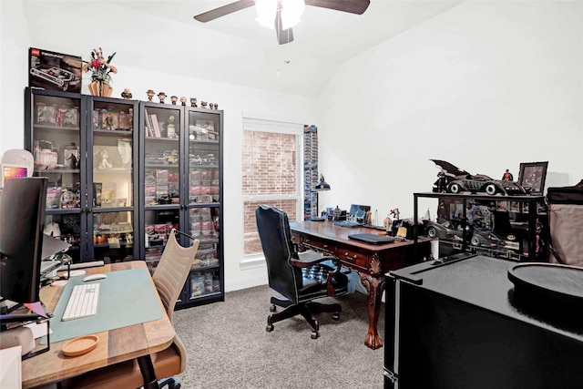 office space featuring ceiling fan, lofted ceiling, and carpet flooring