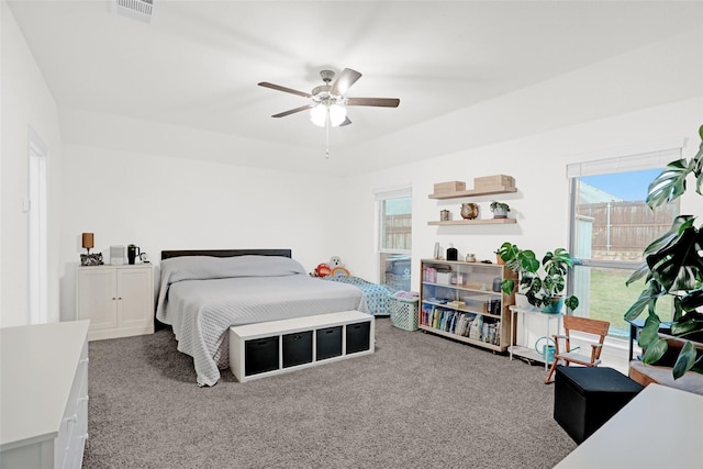 bedroom with a ceiling fan, visible vents, and carpet