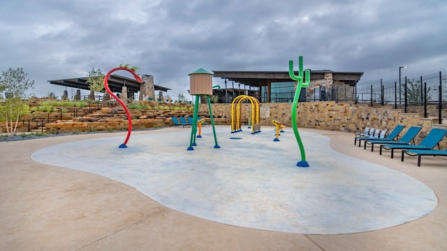 communal playground featuring fence