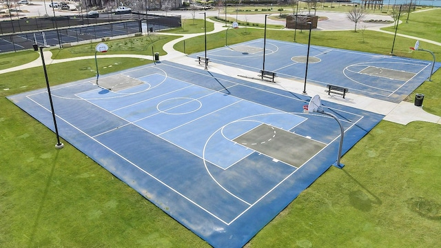 view of basketball court featuring community basketball court and fence