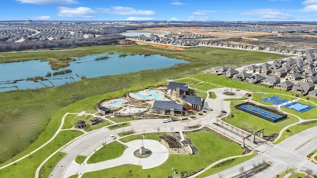bird's eye view featuring a water view and a residential view