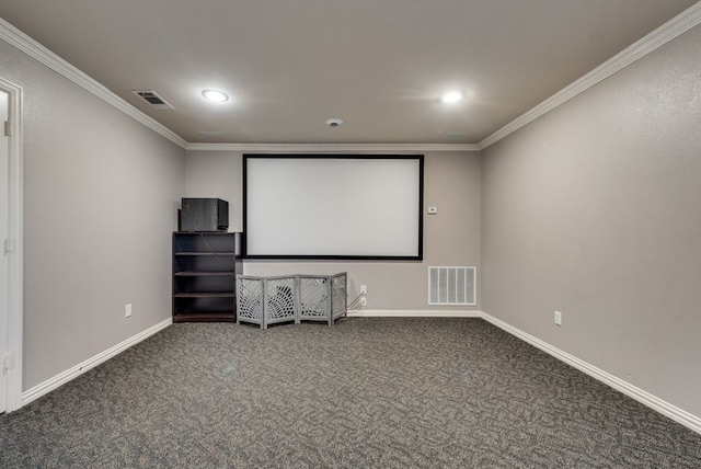 carpeted cinema room with crown molding, baseboards, visible vents, and recessed lighting