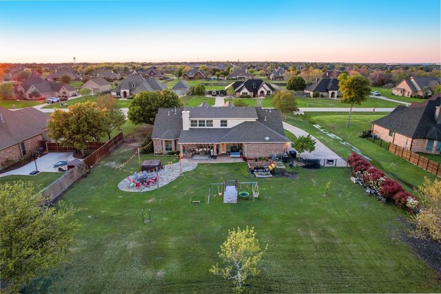 aerial view at dusk with a residential view