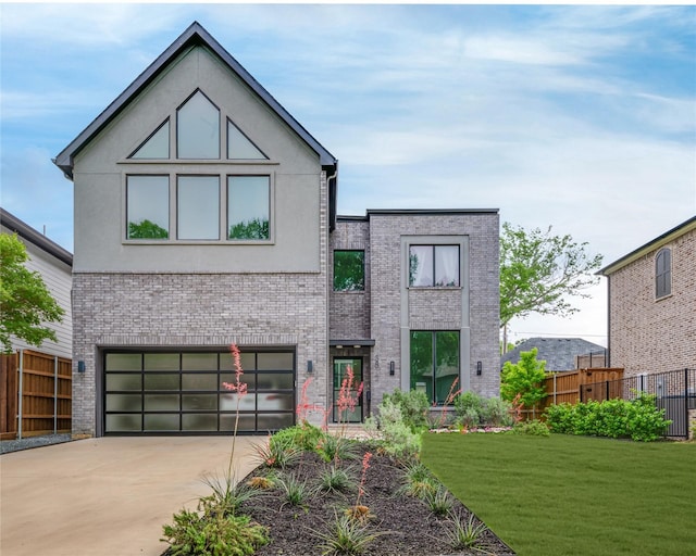 3812 Beechwood Ln, Dallas, TX 75220 - contemporary house with an attached garage, stucco siding, fence, brick siding, and driveway