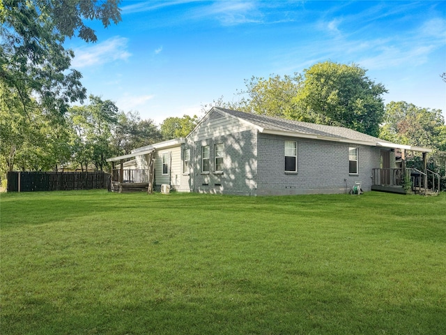 2205 N Farola Dr, Dallas, TX 75228 - rear view of house with a deck, brick siding, and crawl space
