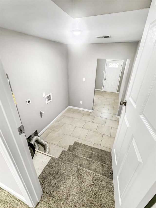 clothes washing area with baseboards, hookup for a washing machine, visible vents, laundry area, and electric dryer hookup