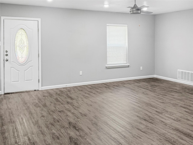 entrance foyer featuring baseboards, visible vents, wood finished floors, and a ceiling fan