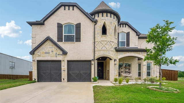 1106 Alaska Dr, Forney, TX 75126 - french country home with concrete driveway, an attached garage, brick siding, and stone siding