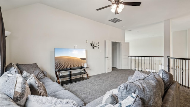 living room featuring vaulted ceiling, carpet flooring, a ceiling fan, and visible vents