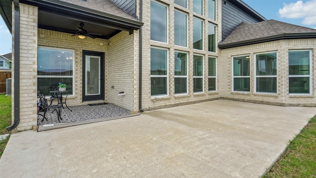 view of patio / terrace featuring a ceiling fan and central AC